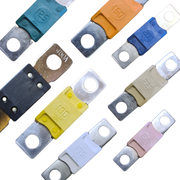 Assorted colored mega fuses for campervan, off-grid, and marine electrical systems on white background.